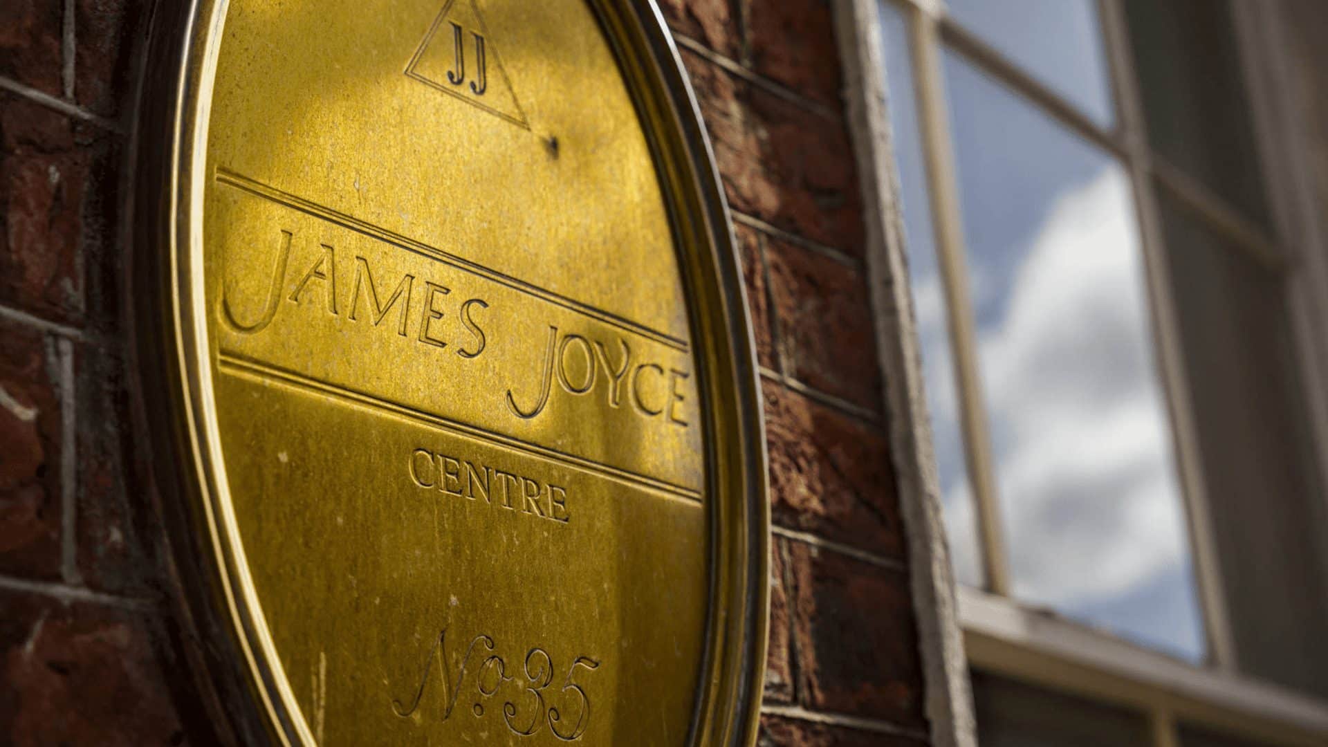 Golden letter sign for James Joyce Center in Dublin, Ireland.