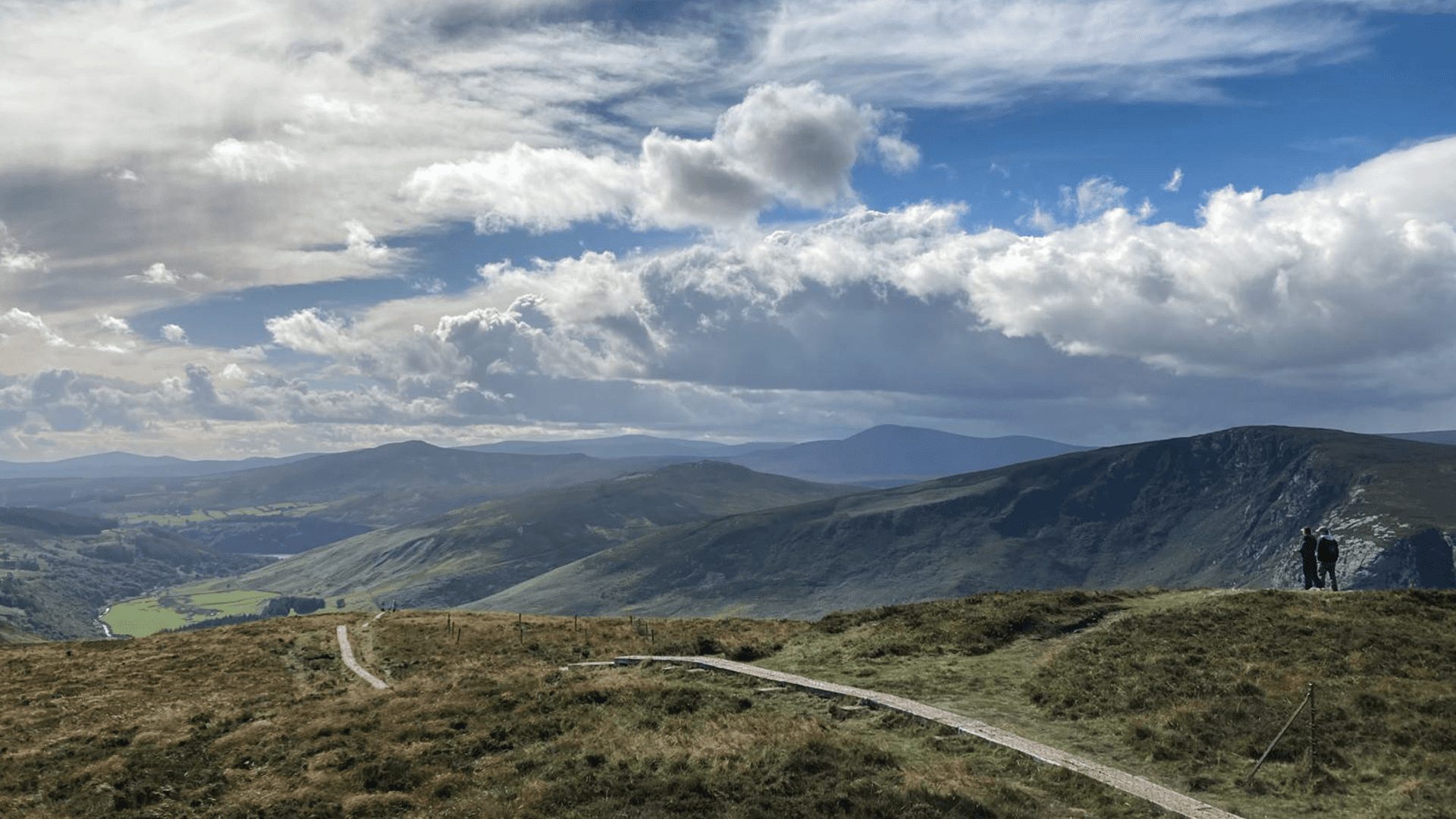 Two people overseeing the vast nature of the Wicklow Mountains National Park, Ireland